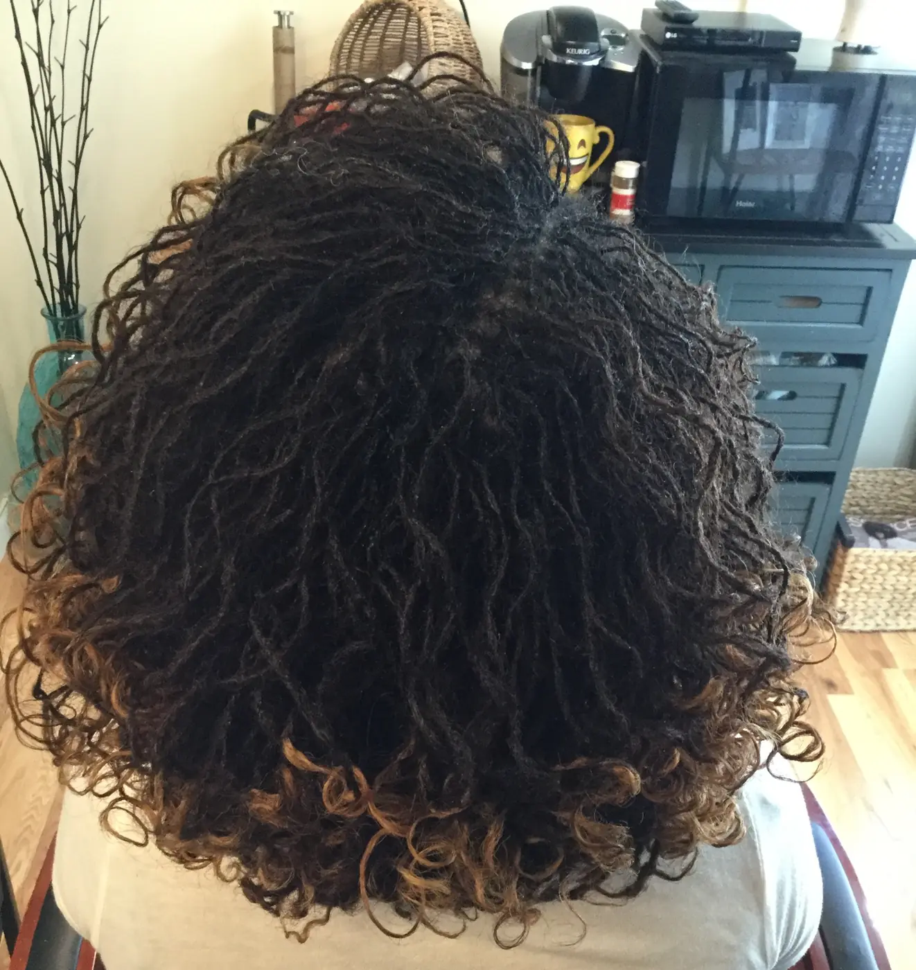 Back view of freshly retightened Sisterlocks styled with soft curled ends